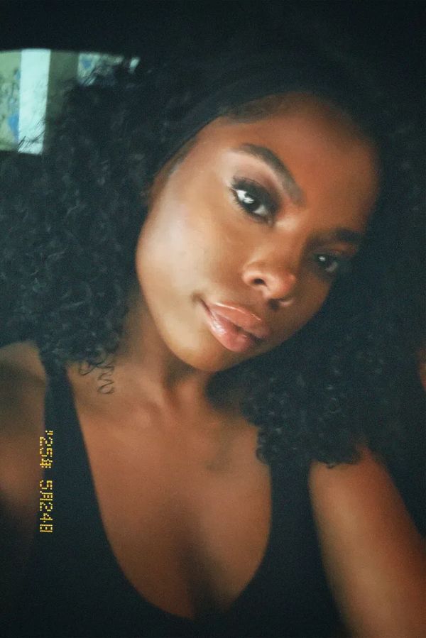 Client wearing Burmese Curly Bundles